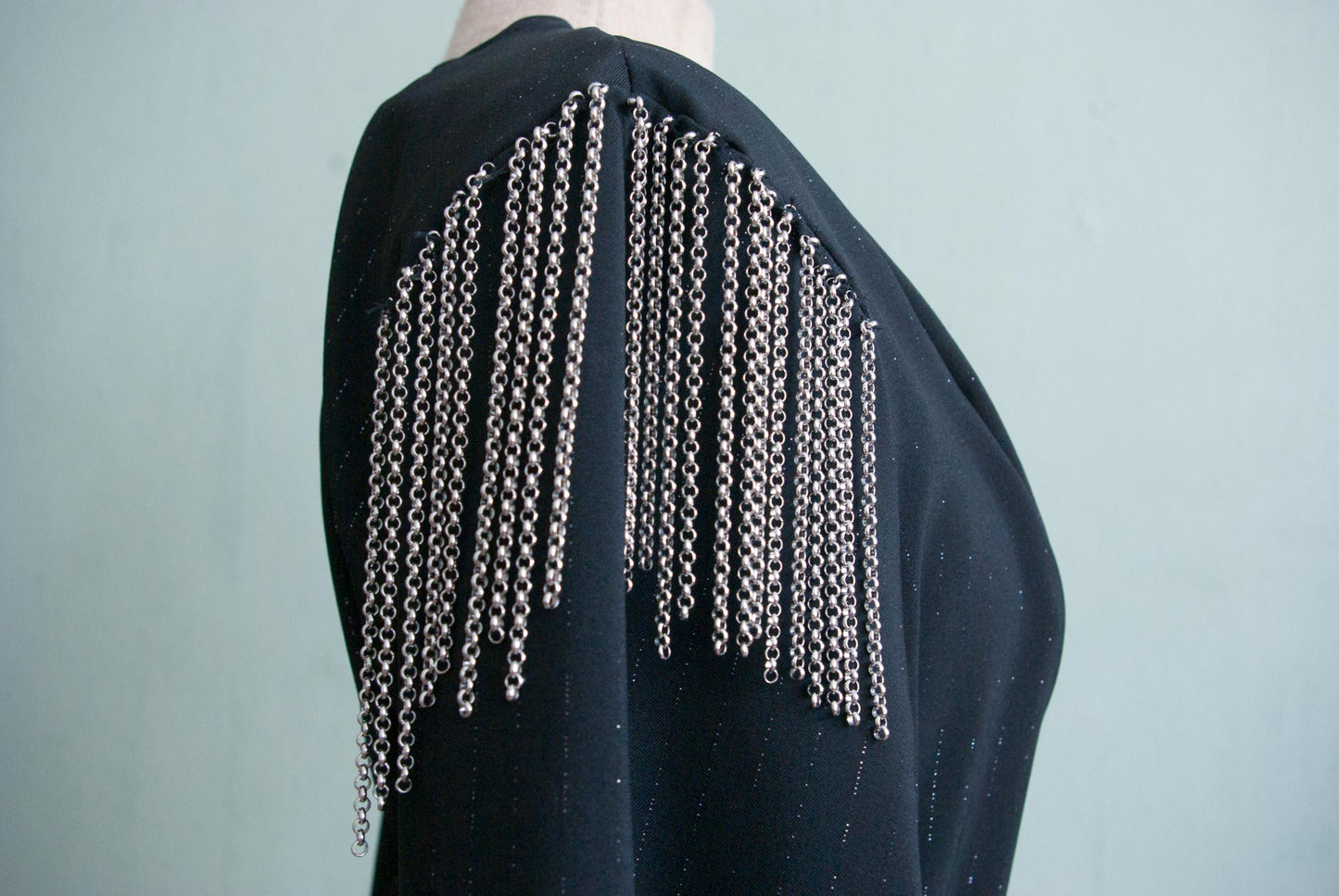 Silver plated chains as fringe on the shoulders