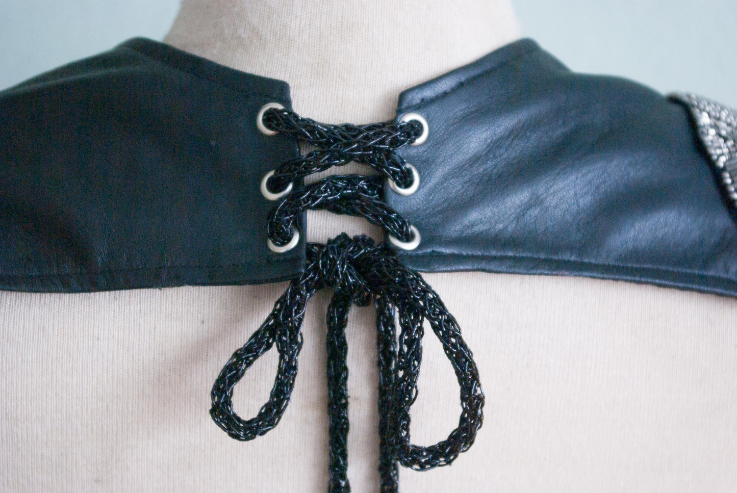 Soft black leather shoulder pauldrons with epaulettes, made of silver beads
