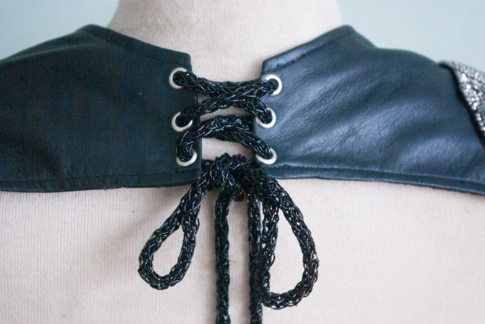 Soft black leather shoulder pauldrons with epaulettes, made of silver beads