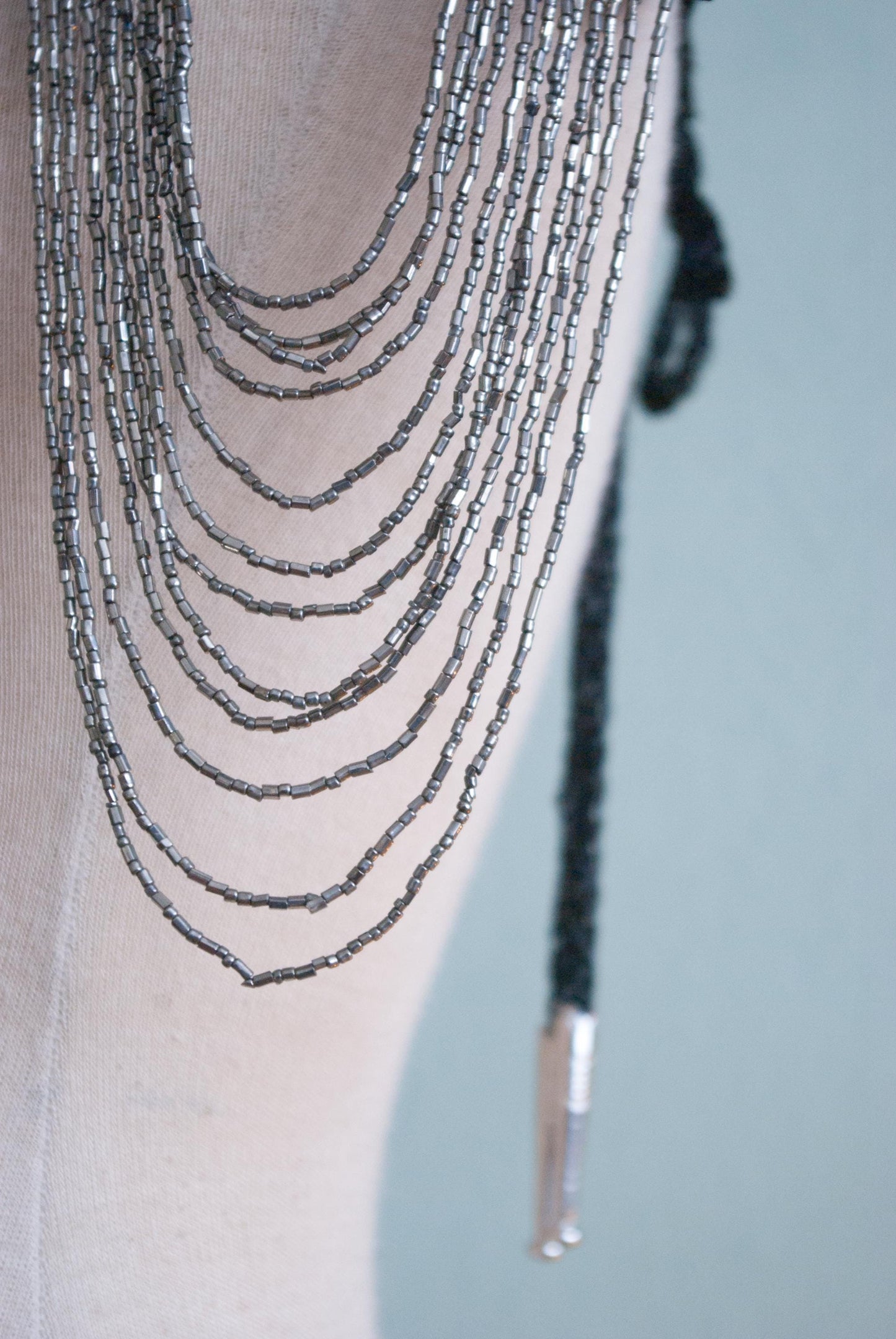 Soft black leather shoulder pauldrons with epaulettes, made of silver beads